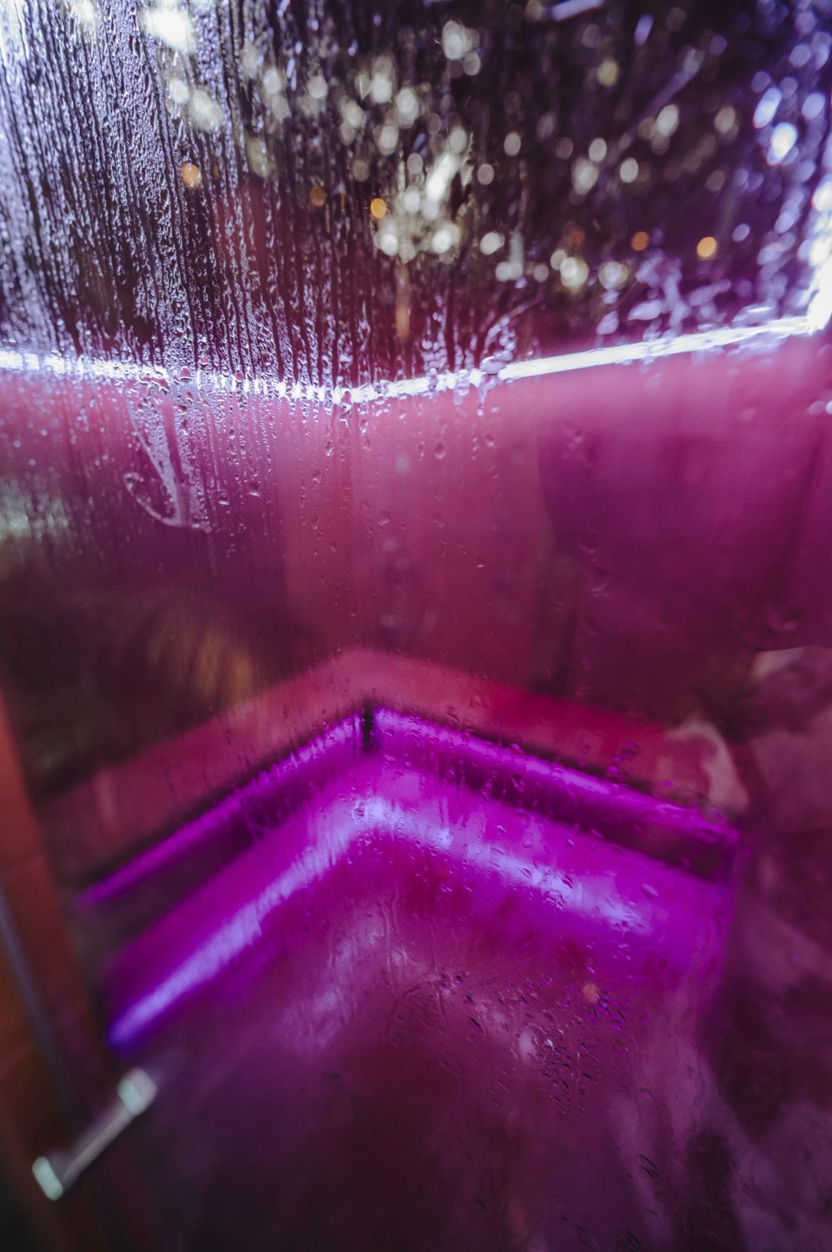 Condensation and coloured light inside the Thai herbal steam room