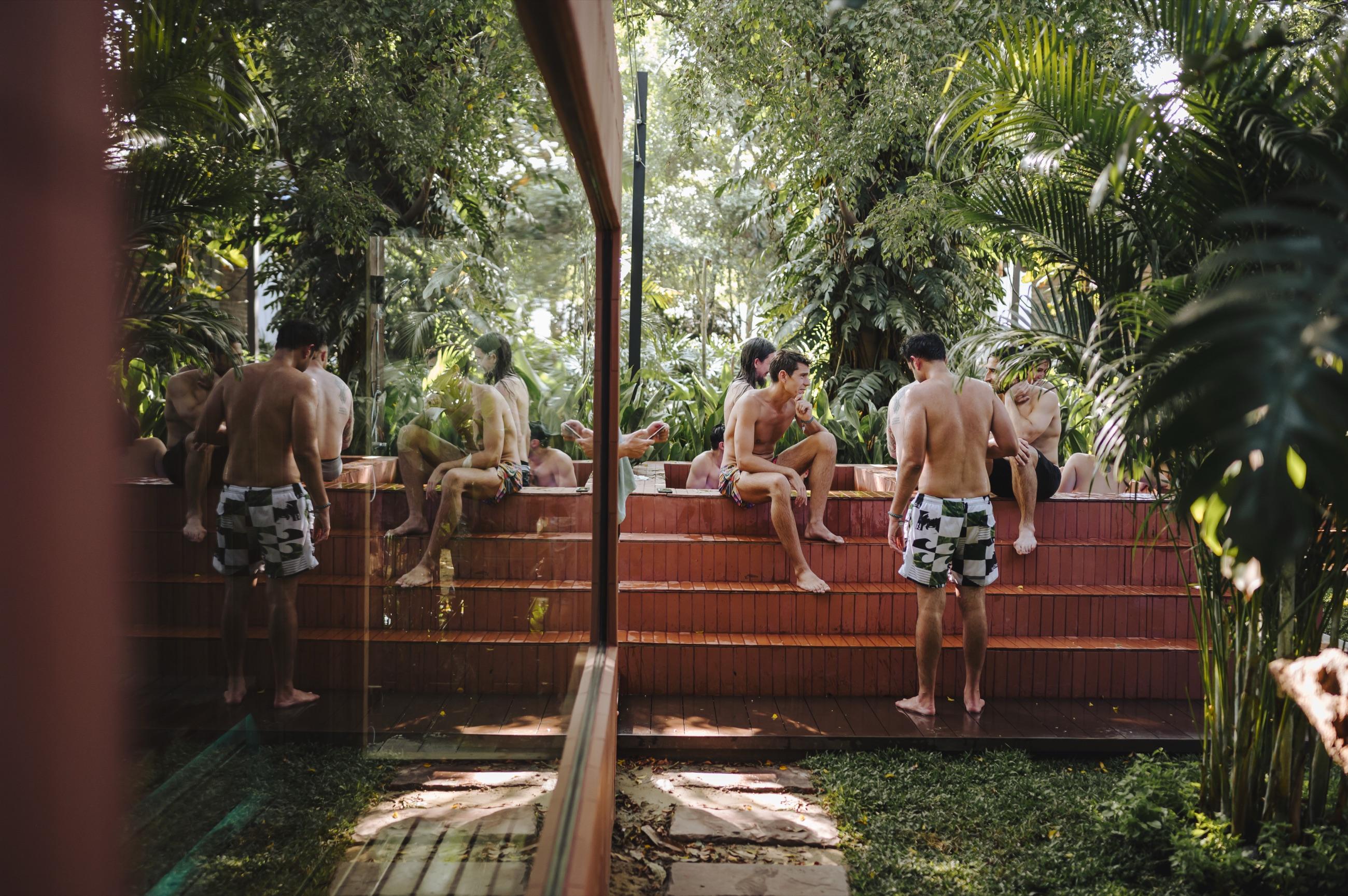 Guests enjoying the tropical garden at Dip Ari
